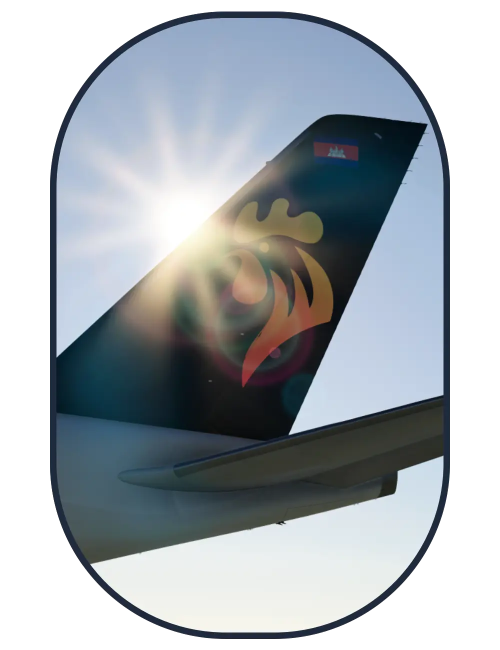 Sun lens flare shining on tail of an Air Combs Airbus A350
